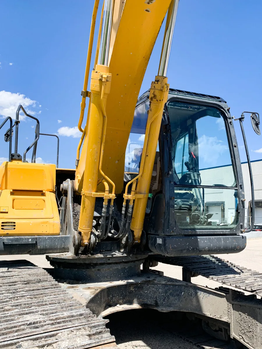 Heavy equipment excavator cab fitted with RockGlass security glass