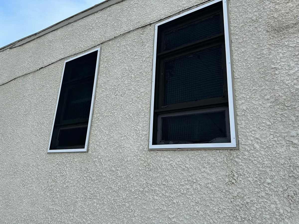 RockScreen security screen fitted over a storefront window opening